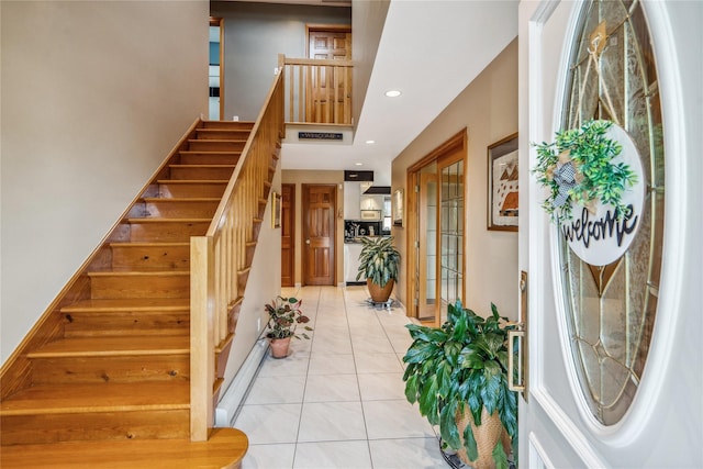 stairway featuring tile patterned floors