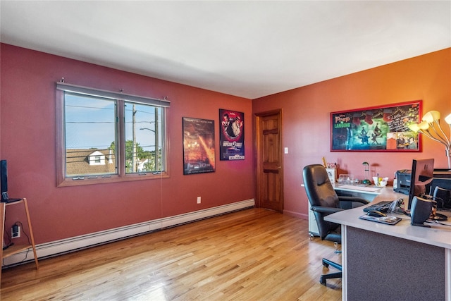 home office featuring light wood-type flooring and baseboard heating