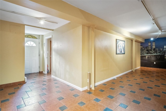 basement featuring track lighting