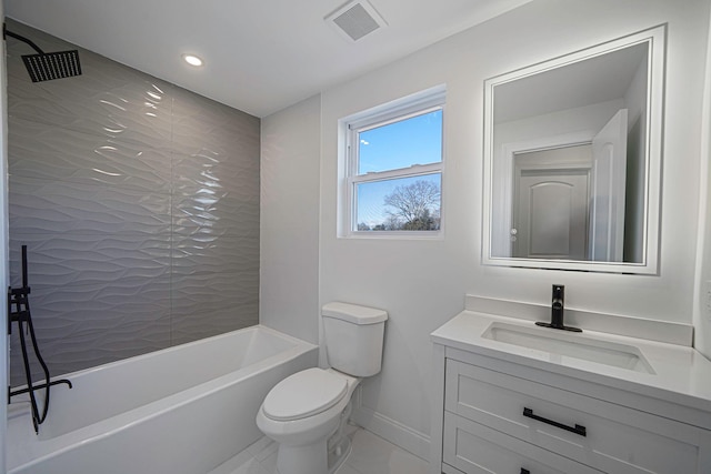 full bathroom featuring tiled shower / bath combo, vanity, and toilet