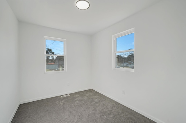 unfurnished room featuring carpet flooring