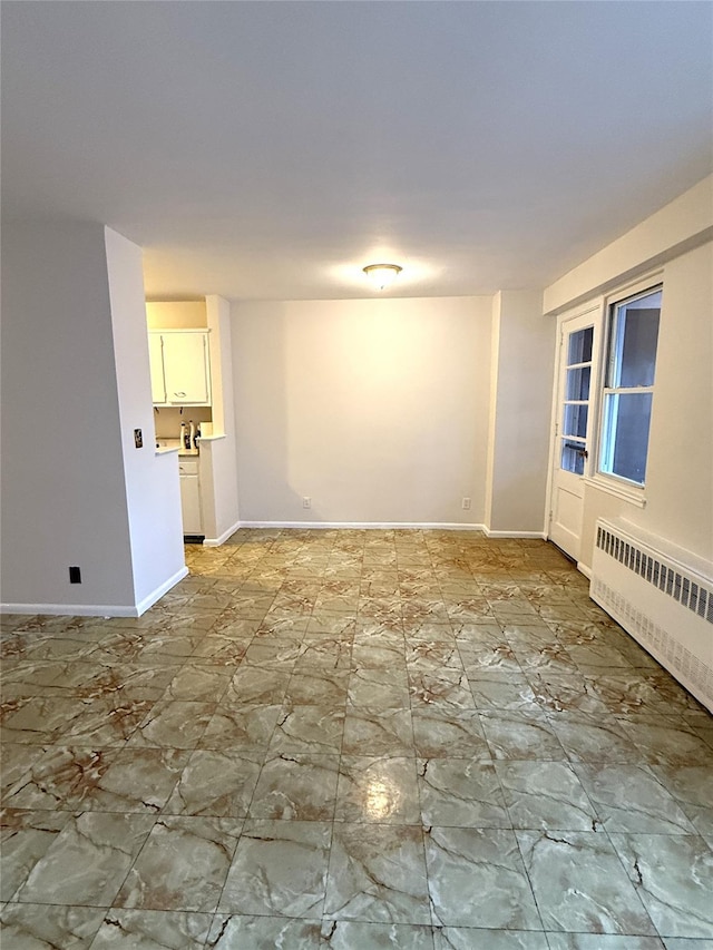 unfurnished room with radiator