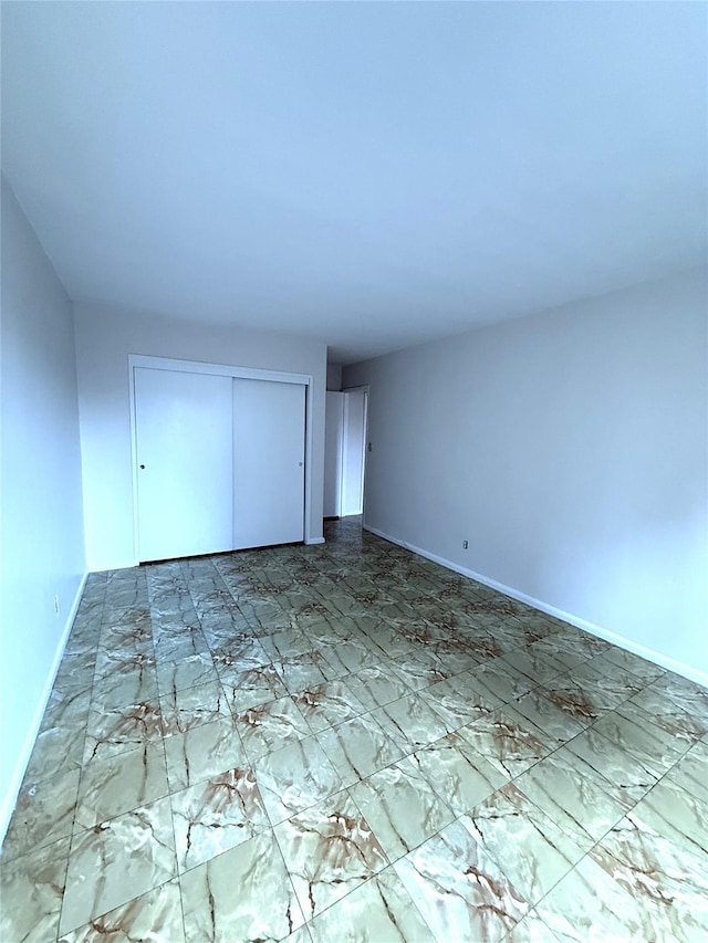 unfurnished bedroom featuring a closet