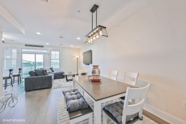 dining space featuring light wood-type flooring