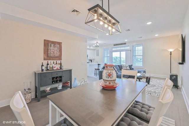 dining area with light hardwood / wood-style floors