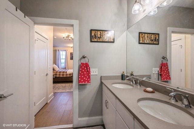 bathroom with vanity and hardwood / wood-style floors