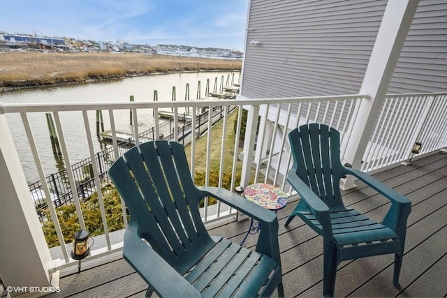 balcony featuring a water view