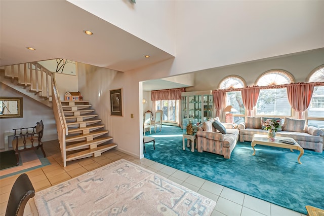 tiled living room featuring baseboards, carpet floors, stairway, and recessed lighting