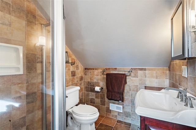 bathroom featuring vanity, tile walls, an enclosed shower, and toilet