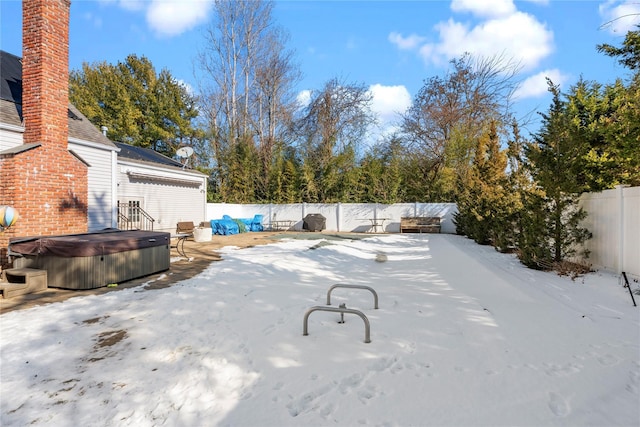 snow covered pool with a hot tub