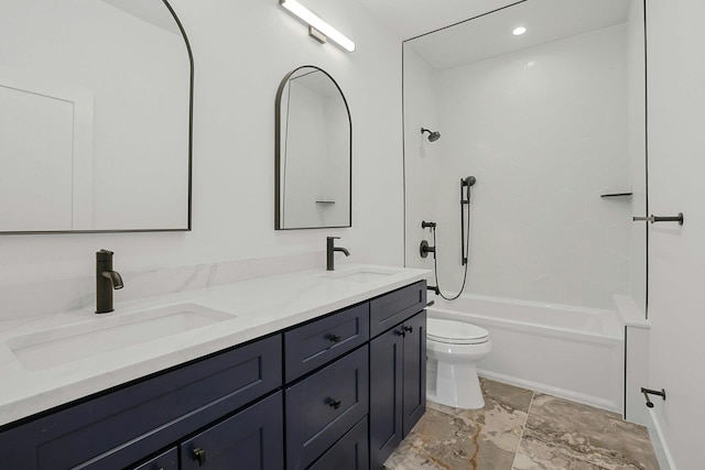 full bath featuring double vanity, tub / shower combination, a sink, and toilet