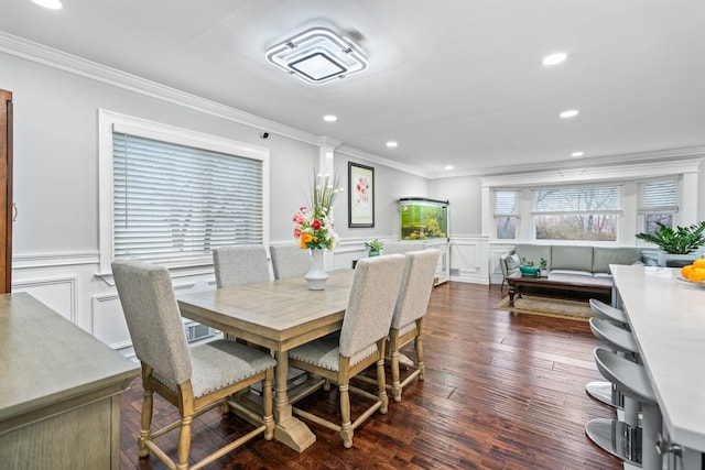 dining space featuring crown molding and dark hardwood / wood-style floors