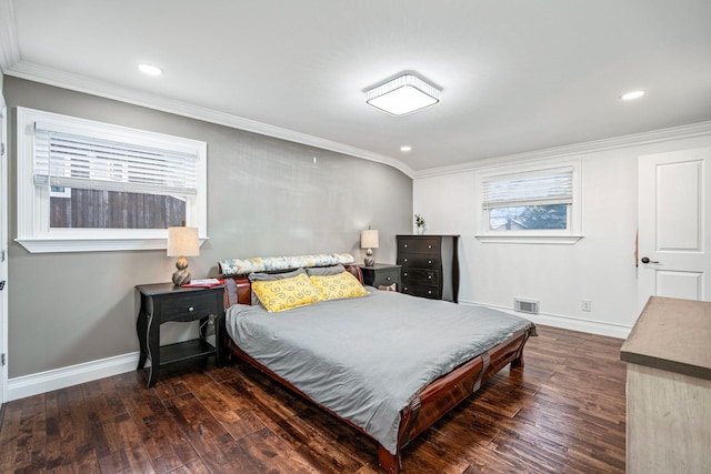 bedroom with ornamental molding and dark wood-type flooring