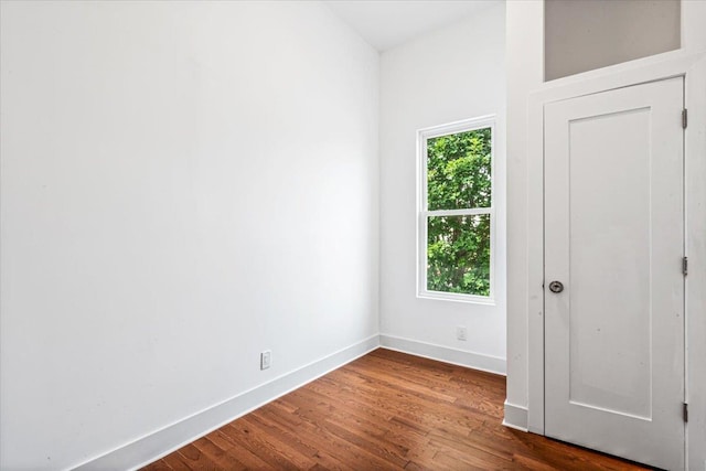 spare room with hardwood / wood-style floors