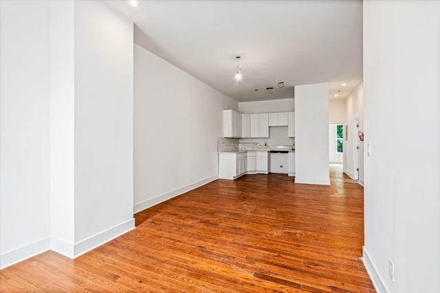 unfurnished living room featuring hardwood / wood-style floors