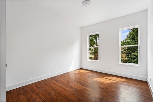 spare room featuring hardwood / wood-style floors