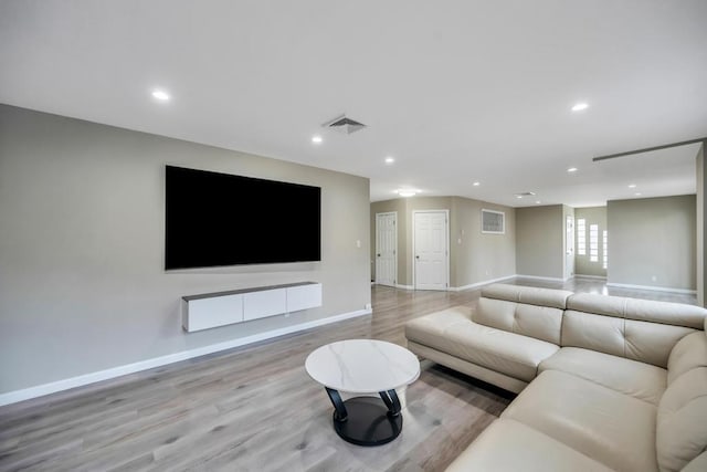 living room with light hardwood / wood-style flooring