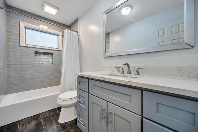 full bathroom with vanity, toilet, and shower / bath combo