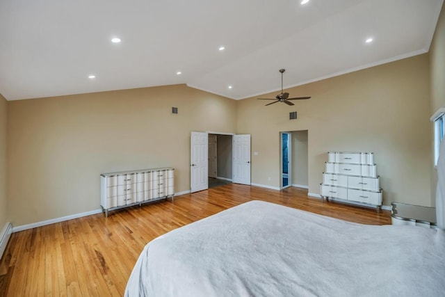 bedroom with wood-type flooring, high vaulted ceiling, ceiling fan, and baseboard heating