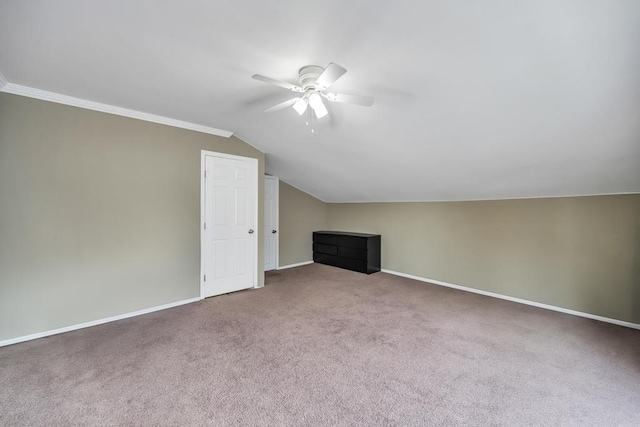 bonus room with lofted ceiling, ceiling fan, and carpet flooring