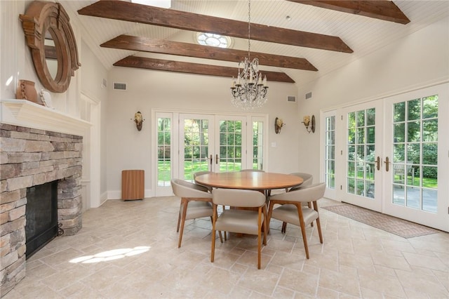 dining area with french doors, wood ceiling, high vaulted ceiling, beamed ceiling, and a fireplace