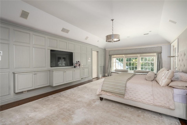 bedroom featuring lofted ceiling and dark hardwood / wood-style flooring