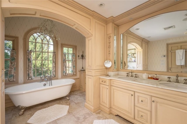 bathroom featuring vanity and a tub to relax in