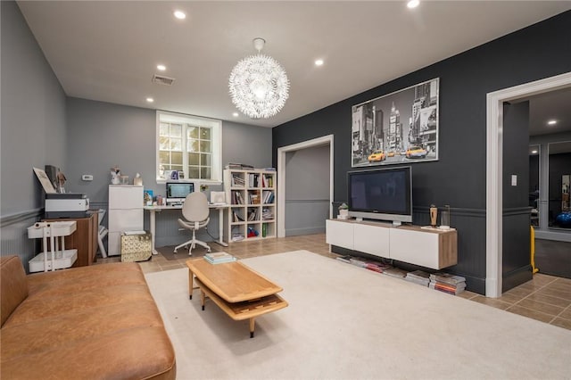 home office with light tile patterned floors and a chandelier