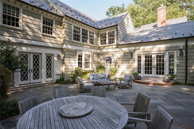 exterior space featuring outdoor lounge area and french doors