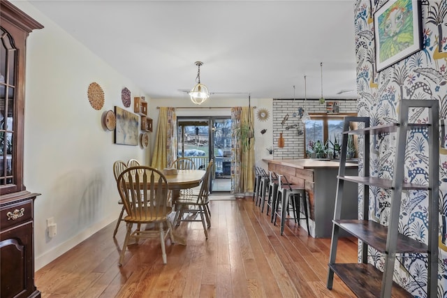 dining space with light wood-type flooring