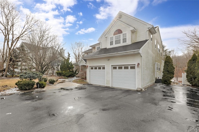 view of property exterior featuring a garage