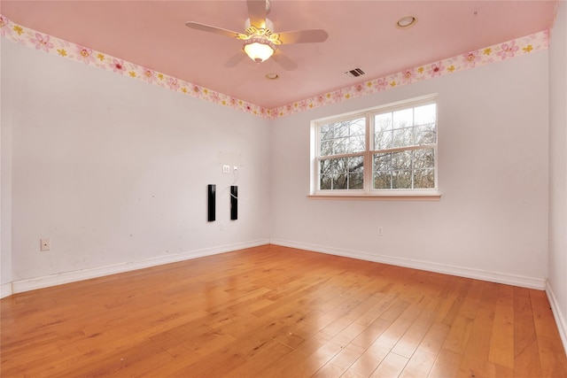 spare room with ceiling fan and light hardwood / wood-style flooring