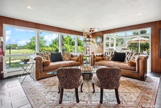 sunroom with a baseboard radiator