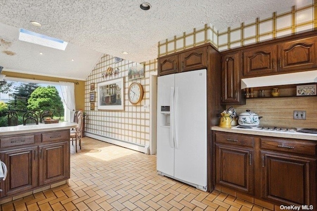 kitchen with lofted ceiling with skylight, dark brown cabinets, a textured ceiling, a baseboard radiator, and white appliances