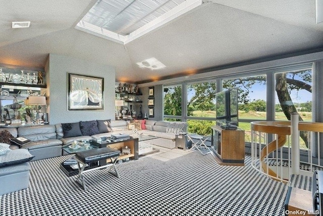 interior space with lofted ceiling and a healthy amount of sunlight