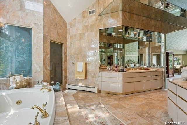 bathroom with high vaulted ceiling, tile walls, vanity, a relaxing tiled tub, and baseboard heating