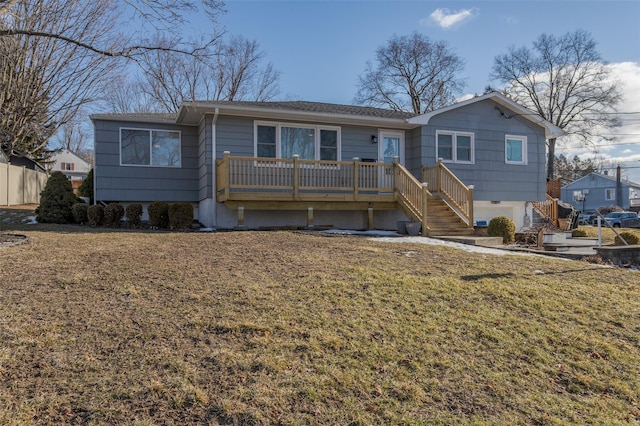 back of house with a yard and a deck