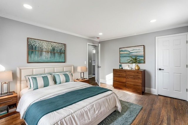 bedroom with ornamental molding and dark hardwood / wood-style floors