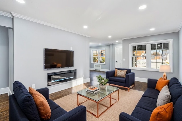 living room with hardwood / wood-style flooring and ornamental molding