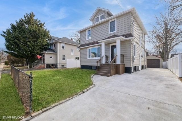 view of front of property featuring a garage, an outdoor structure, and a front lawn