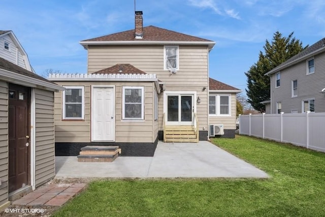 back of property featuring a yard and a patio area