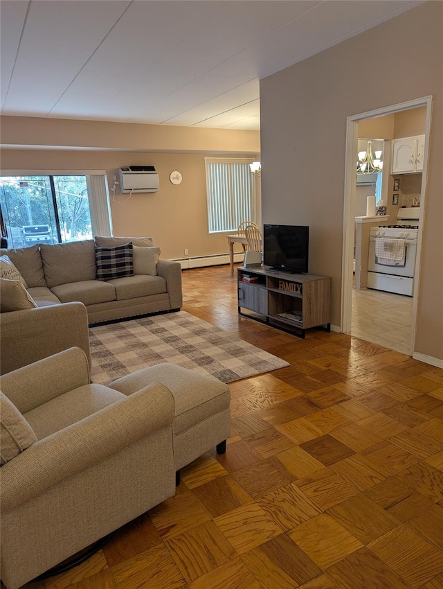 living room with an AC wall unit, an inviting chandelier, and baseboard heating