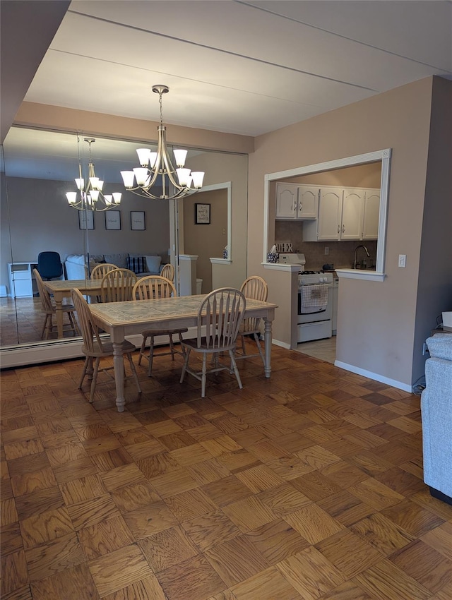 dining room with sink and an inviting chandelier