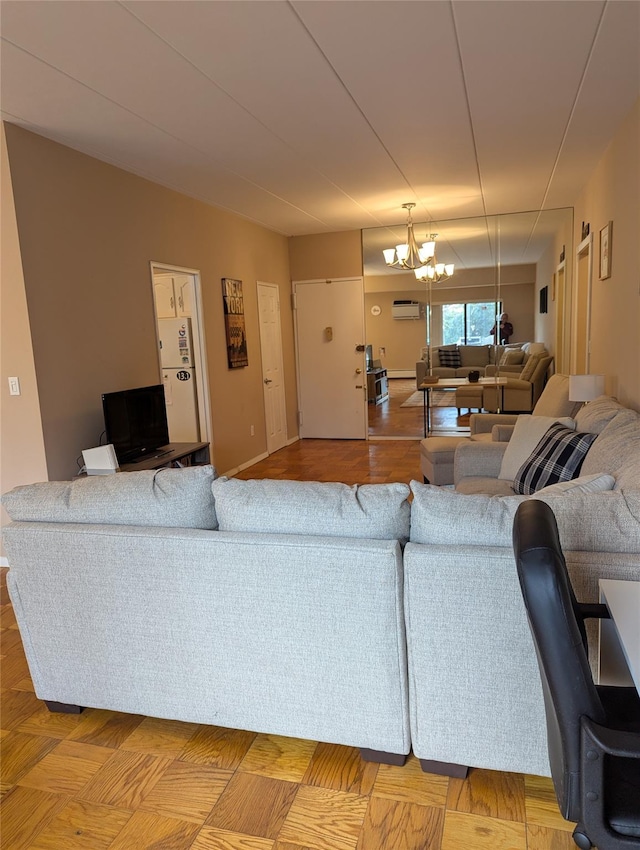 living room featuring an inviting chandelier and a wall mounted air conditioner