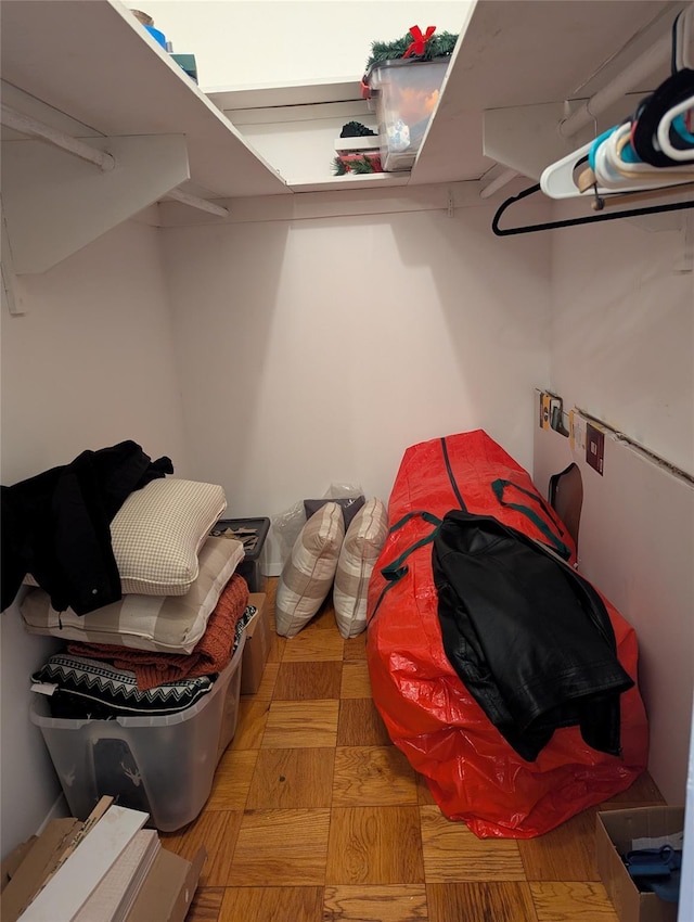 spacious closet with light parquet floors