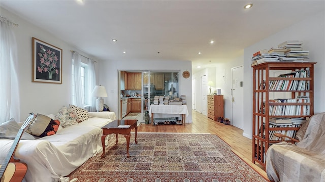 bedroom featuring recessed lighting, stainless steel fridge, and light wood-style flooring