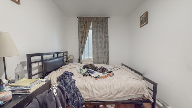 bedroom with wood finished floors