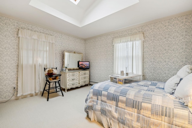 bedroom featuring baseboard heating, crown molding, a skylight, and carpet floors