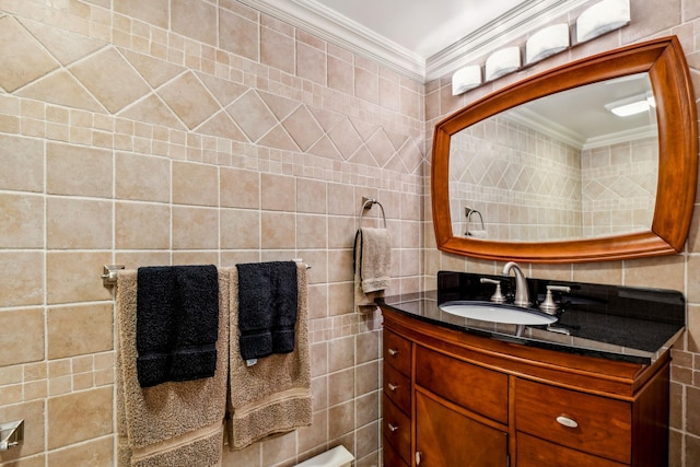 bathroom with tile walls, vanity, and ornamental molding