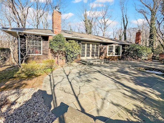 back of house featuring french doors